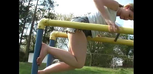  Young teen plays in the park and flashes her body